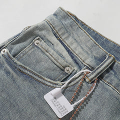 Purple‑Brand Light Blue Wash Knee Rip Straight Leg Jeans