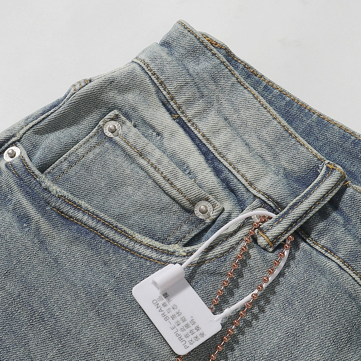 Purple‑Brand Light Blue Wash Knee Rip Straight Leg Jeans